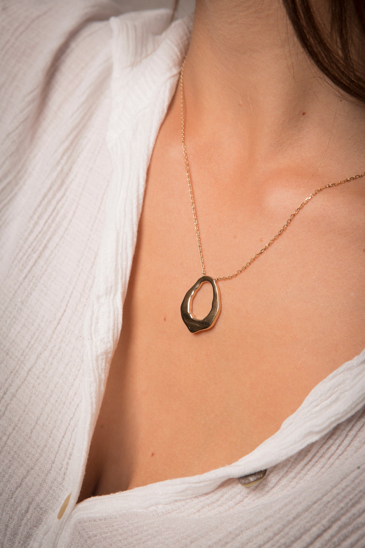collier plaqué or motif oval
