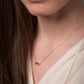 collier argent motif cylindre
