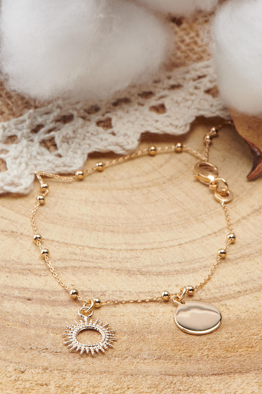 bracelet plaqué or avec pendentif soleil