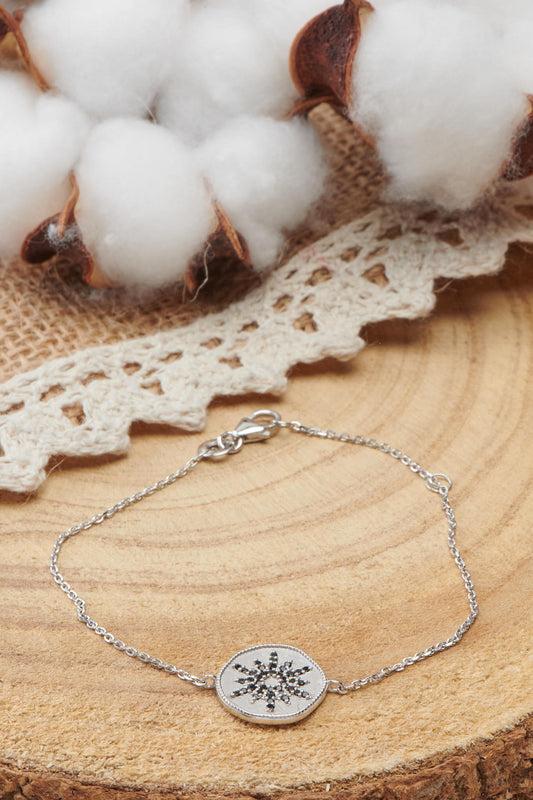 bracelet en argent motif soleil noir