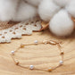 Bracelet en plaqué or 18 carats 3 microns Orné de perles et de petits cubes.